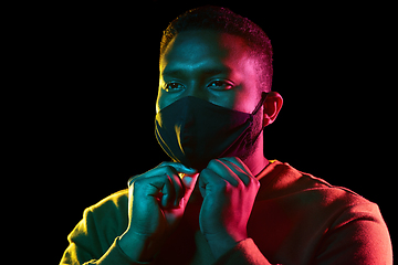 Image showing african american man wearing black reusable mask