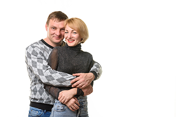 Image showing Portrait of a young couple, a man hugging a woman, isolated on a white background