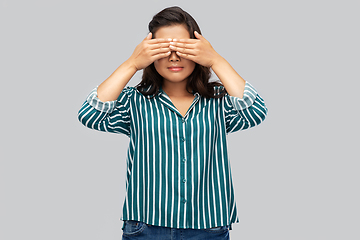 Image showing woman with eyes closed by hands