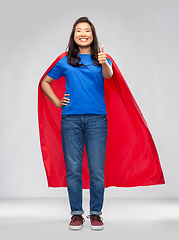 Image showing asian woman in superhero cape showing thumbs up