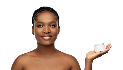 Image showing smiling african american woman with moisturizer