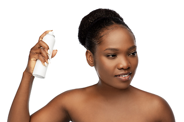 Image showing young african woman with hairspray