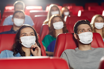 Image showing people in masks watching movie in theater