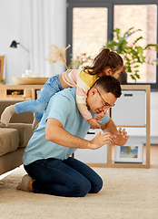 Image showing happy father with little daughter at home