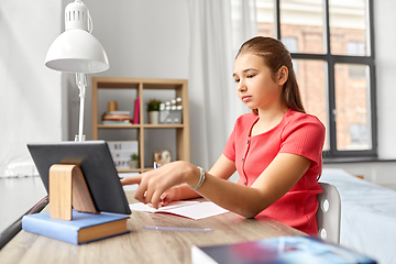 Image showing student girl with tablet pc learning at home