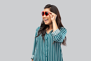 Image showing happy asian woman with in heart shaped sunglasses