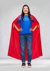Image showing happy asian woman in red superhero cape