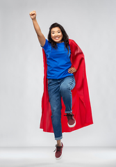 Image showing happy asian woman in red superhero cape