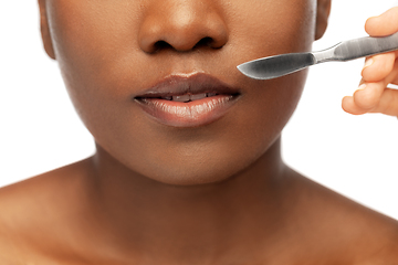 Image showing face of african american woman and scalpel knife