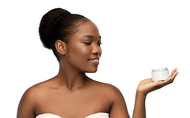 Image showing smiling african american woman with moisturizer