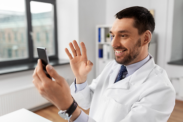 Image showing doctor with smartphone having video call at clinic