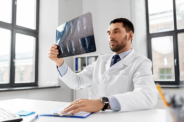 Image showing male doctor with x-ray of spine at hospital