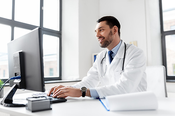 Image showing male doctor with computer working at hospital