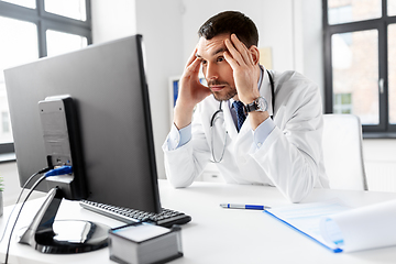 Image showing male doctor with computer working at hospital