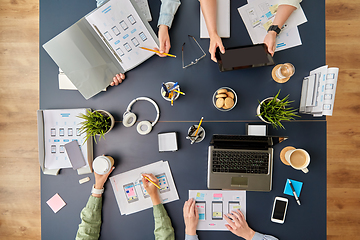 Image showing business team with gadgets working at office table