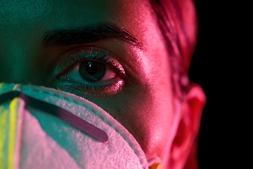 Image showing young woman wearing protective mask or respirator