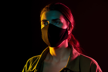 Image showing young woman wearing reusable protective mask