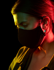 Image showing young woman wearing reusable protective mask