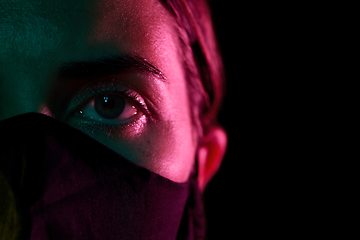 Image showing young woman wearing reusable protective mask