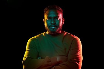 Image showing young african american man over black background