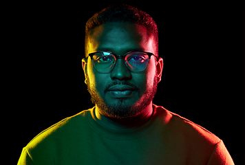 Image showing young african american man in glasses over black