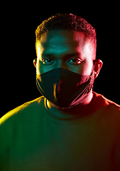 Image showing african american man wearing black reusable mask