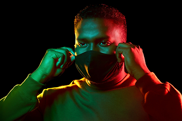 Image showing african american man wearing black reusable mask