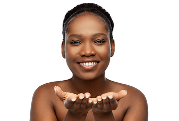 Image showing happy african american woman holding something