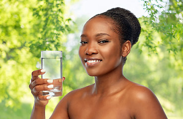 Image showing young african american woman with glass of water