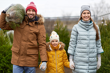 Image showing happy family buying christmas tree at market