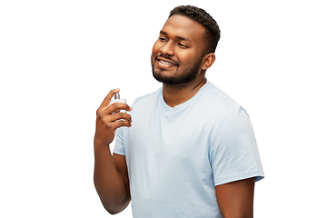 Image showing happy african american man with perfume