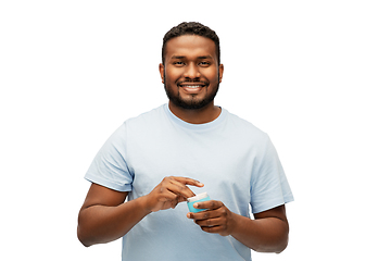 Image showing happy african american man with moisturizer