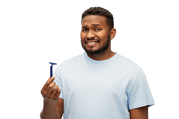 Image showing african american man holding razor blade