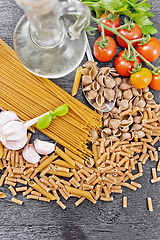 Image showing Pasta different whole grain and rye on dark board top