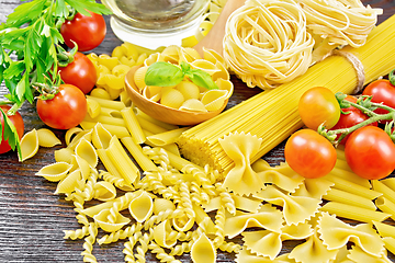 Image showing Pasta different with oil and tomatoes on table