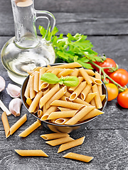 Image showing Penne whole grain in bowl with vegetables on table