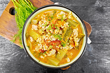 Image showing Ragout of zucchini and minced meat in bowl on board top