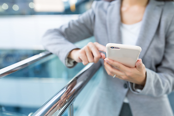 Image showing Businesswoman working on cellphone