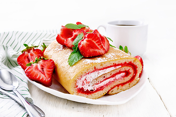 Image showing Roll with cream and strawberries in plate on white board