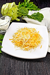 Image showing Salad of carrot and kohlrabi in plate on dark board