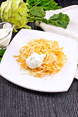 Image showing Salad of carrot and kohlrabi with sour cream in plate on board