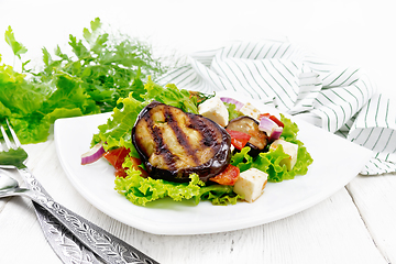 Image showing Salad of eggplant with cheese and tomatoes on board