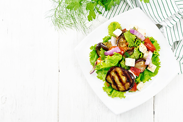 Image showing Salad of eggplant with cheese and tomatoes on light board top