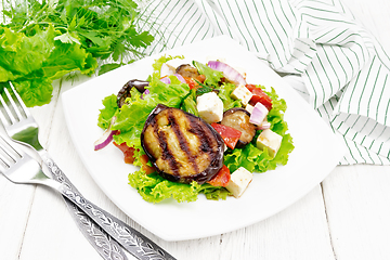 Image showing Salad of eggplant with cheese and tomatoes on wooden board