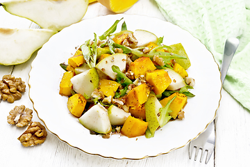 Image showing Salad of pumpkin and pear in plate on white board