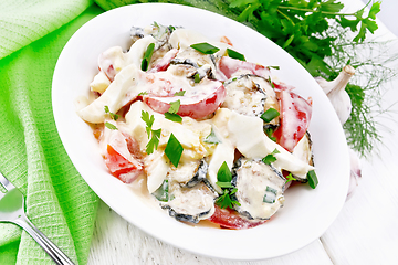 Image showing Salad with fried zucchini in plate on white board