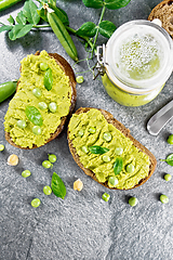 Image showing Sandwich green pea hummus on stone granite table top