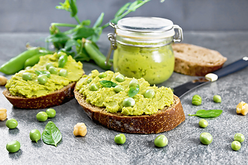 Image showing Sandwich green pea hummus on stone granite table