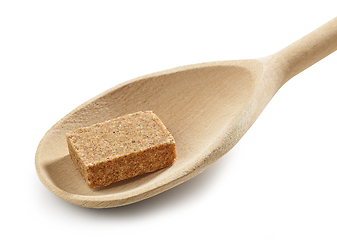 Image showing instant beef broth cube in wooden spoon