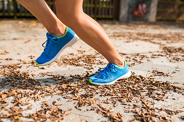 Image showing Woman jogging in a park